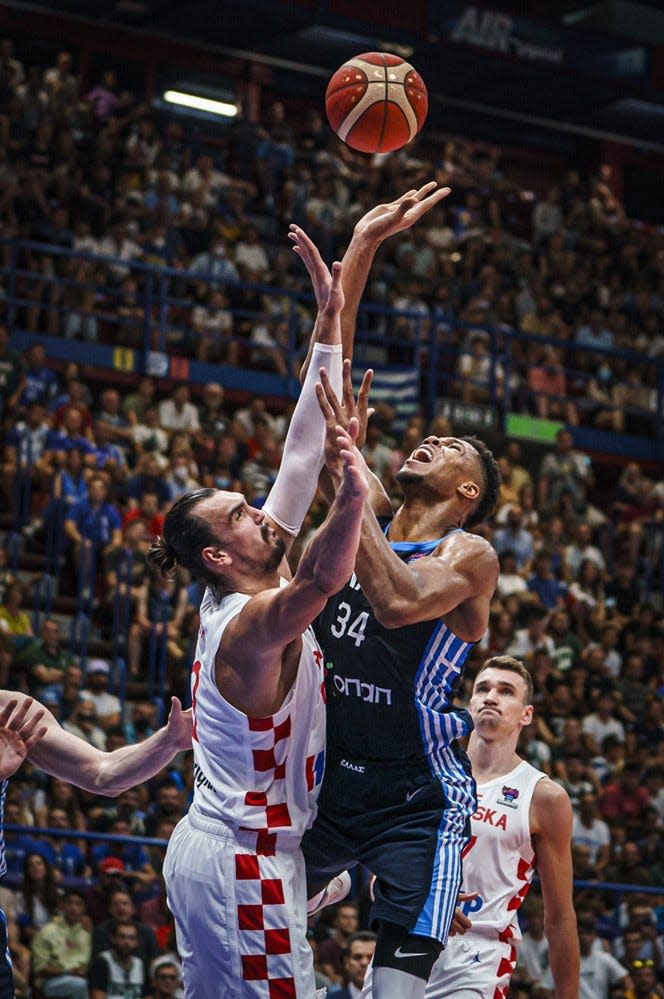 Dario Saric defends Giannis Antetokounmpo in Croatia's matchup versus Greece in EuroBasket play in Milan, Italy.