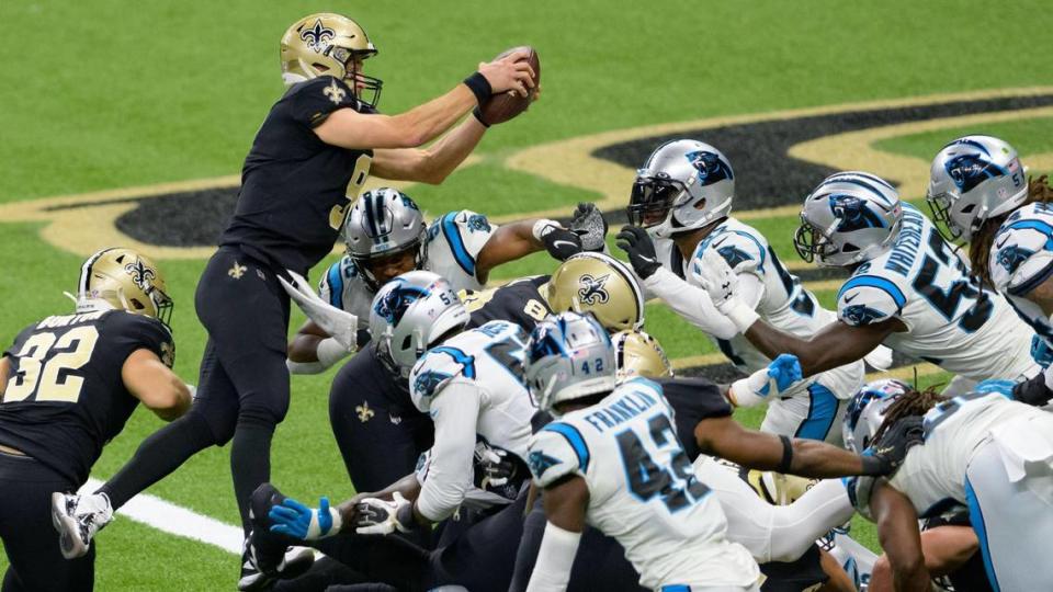 New Orleans Saints quarterback Drew Brees (9) scores against the Carolina Panthers last October. Although Brees is retired, the Saints still whipped Green Bay, 38-3, in their season opener.