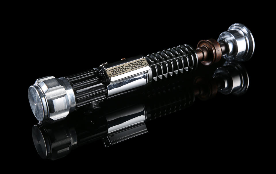 Obi-Wan Kenobi's (Ewan McGregor) Hero Lightsaber from Revenge of the Sith (2005). Estimate £80,000 - £120,000. (Propstore)