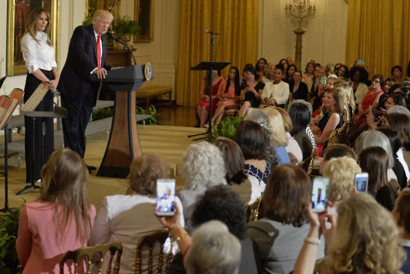 President Donald Trump makes remarks with first lady Melania Trump during a Mother's Day event to honor military spouses May 12. On May 10, 1908, Mother's Day was observed for the first time in the United States. File Photo by Mike Theiler/UPI