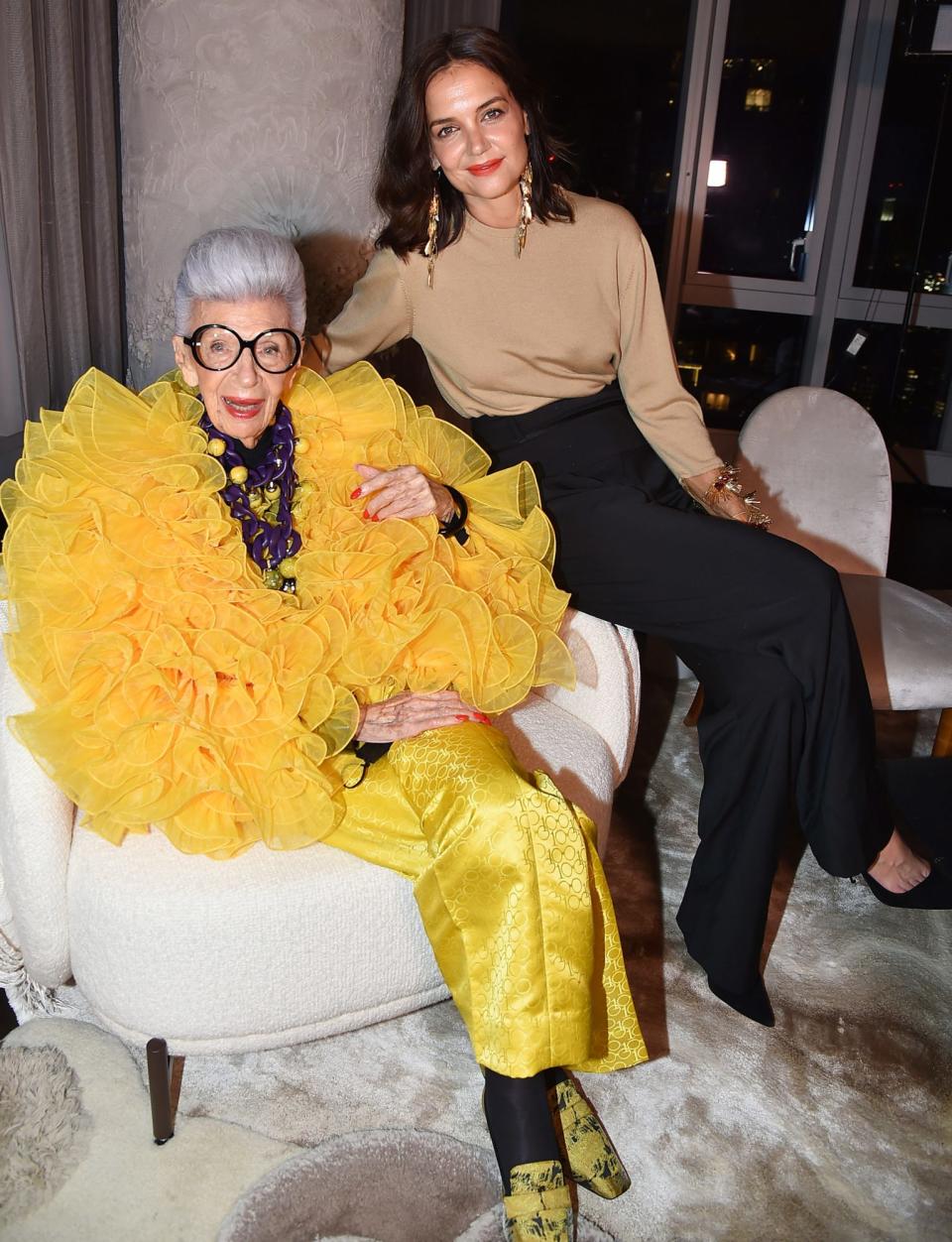 <p>Katie Holmes poses with birthday girl Iris Apfel at the fashion icon's 100th birthday party at Central Park Tower on Sept. 9 in N.Y.C. </p>