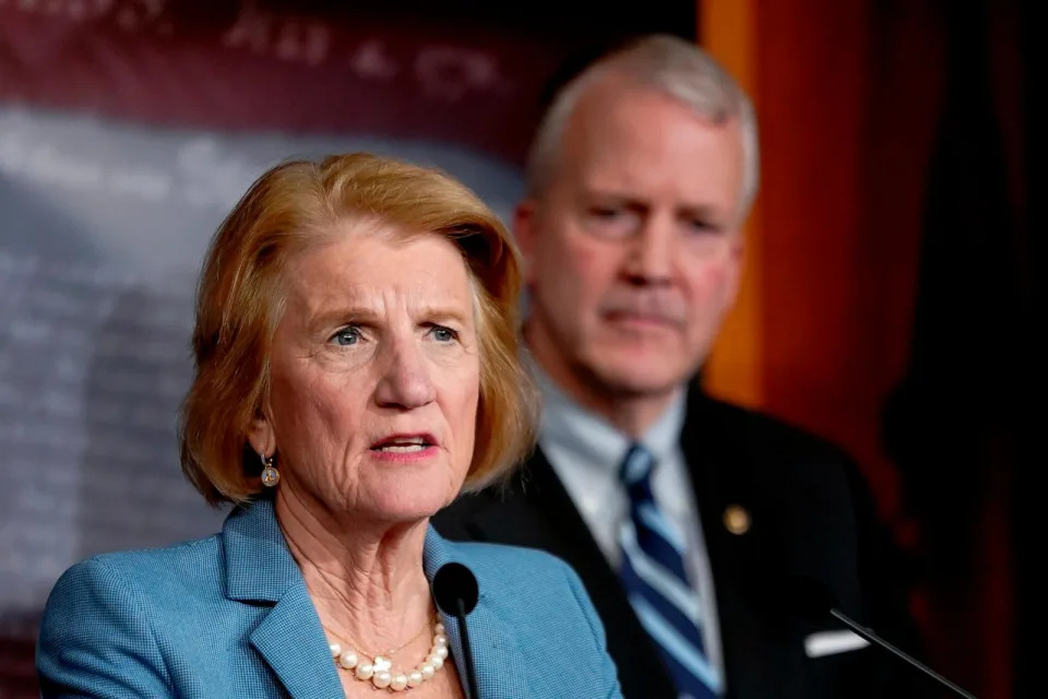 PHOTO: Sen. Shelley Moore Capito, R-W.Va.,, left, speaks during a news conference on the Administration's pause on LNG exports, Feb. 8, 2024, on Capitol Hill in Washington, as Sen. Dan Sullivan, R-Alaska, right, looks on. (Mariam Zuhaib/AP)