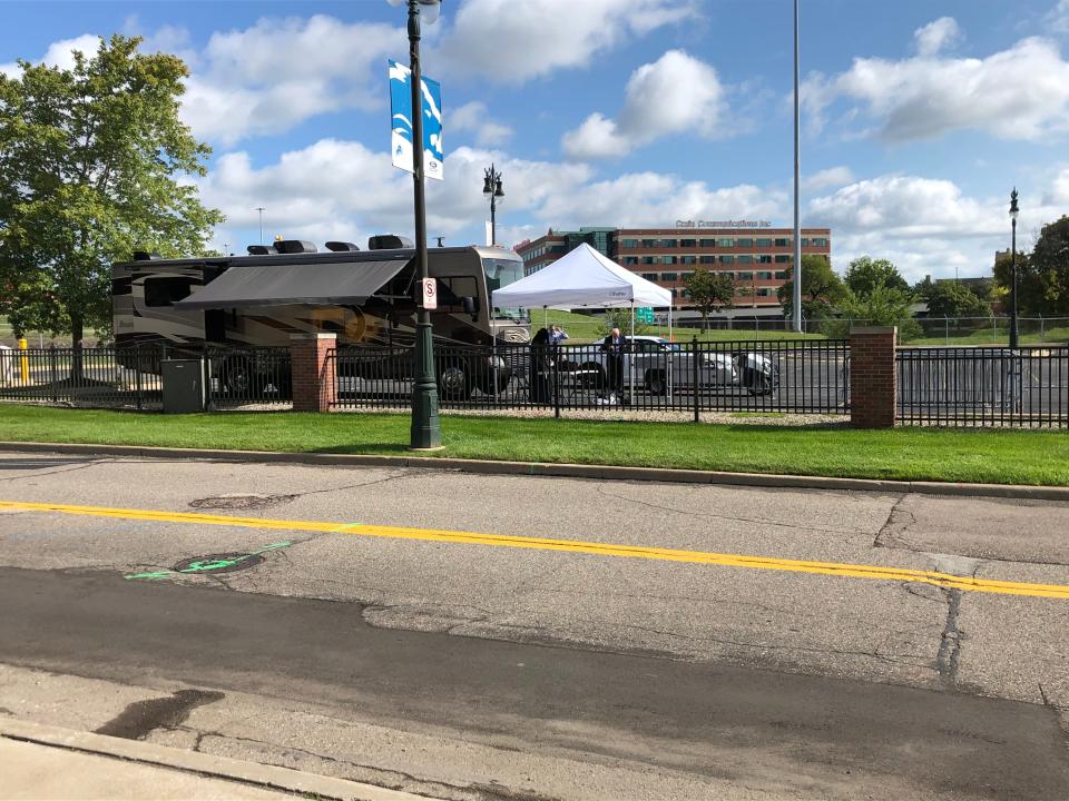 An RV sits in what would usually be a full parking lot next to Ford Field where the Fox broadcasting crew had their temperatures checked before the Detroit Lions' season opener against the Chicago Bears on Sunday, Sept. 13, 2020.