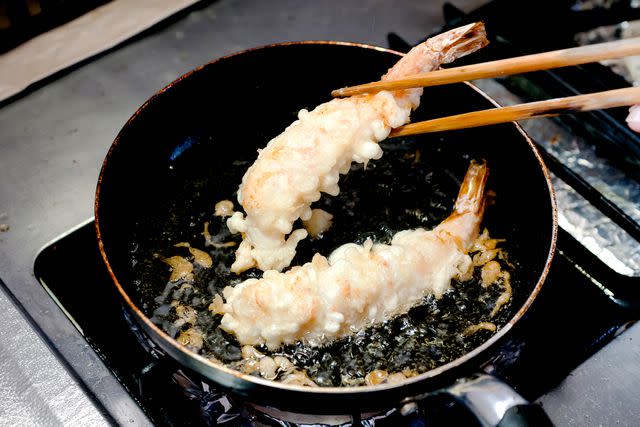 <p>karimitsu/Getty Images</p> Learning to cook shrimp tempura in Japan.
