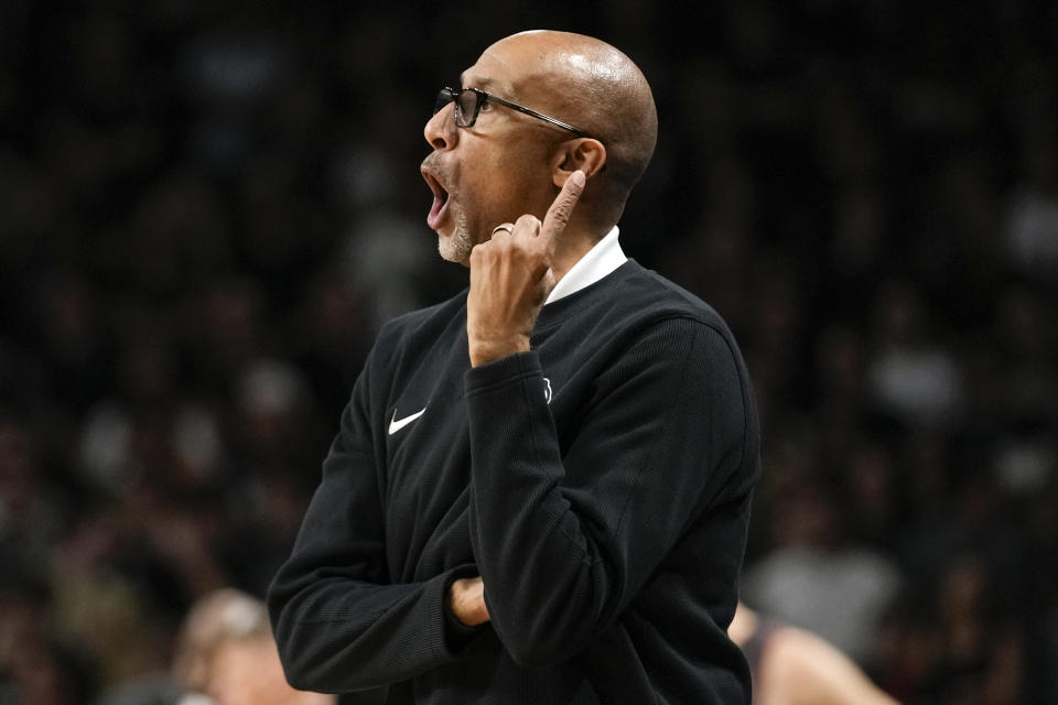 Central Florida head coach Johnny Dawkins yells out to players on the court during the first half of an NCAA college basketball game against Oklahoma, Saturday, Feb. 3, 2024, in Orlando, Fla. (AP Photo/John Raoux)
