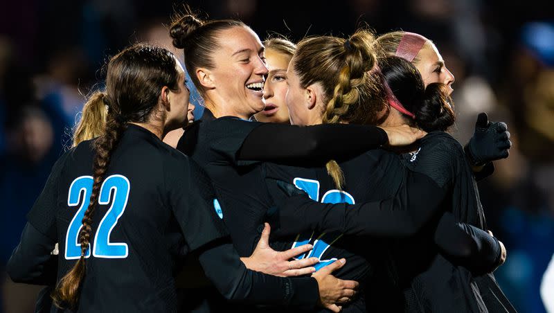 Brigham Young University teammates celebrate forward Brecken Mozingo (13) after making a penalty kick during the Sweet 16 round of the NCAA College Women’s Soccer Tournament against Michigan State at South Field in Provo on Saturday, Nov. 18, 2023.