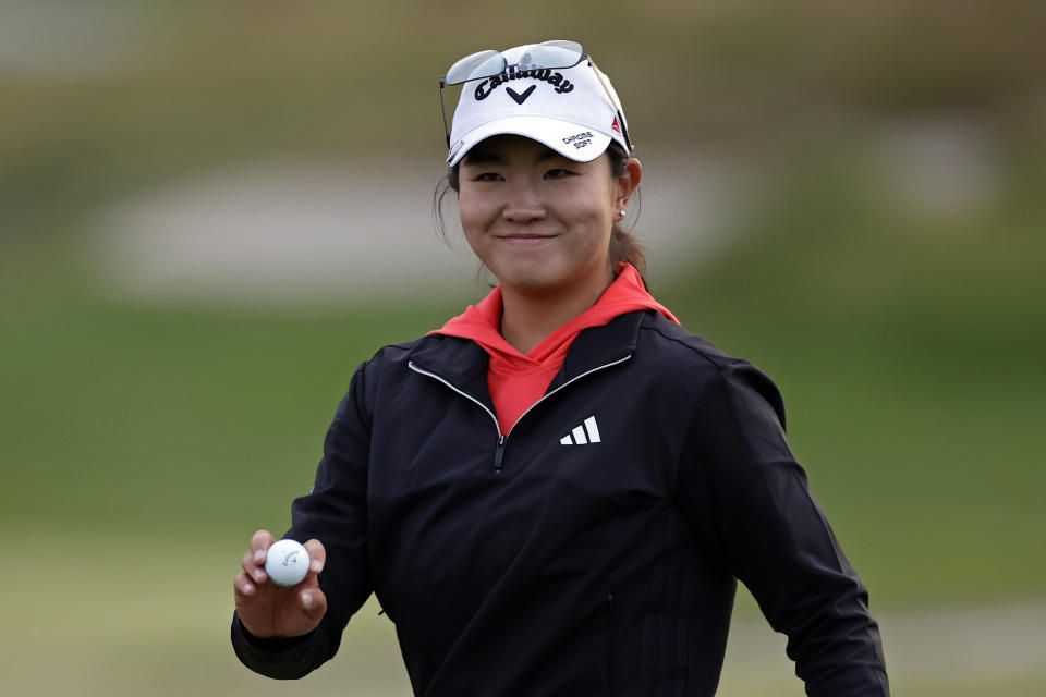 Rose Zhang reacts after making a putt on the first playoff hole during the final round of the Mizuho Americas Open golf tournament, Sunday, June 4, 2023, in Jersey City, N.J. (AP Photo/Adam Hunger)