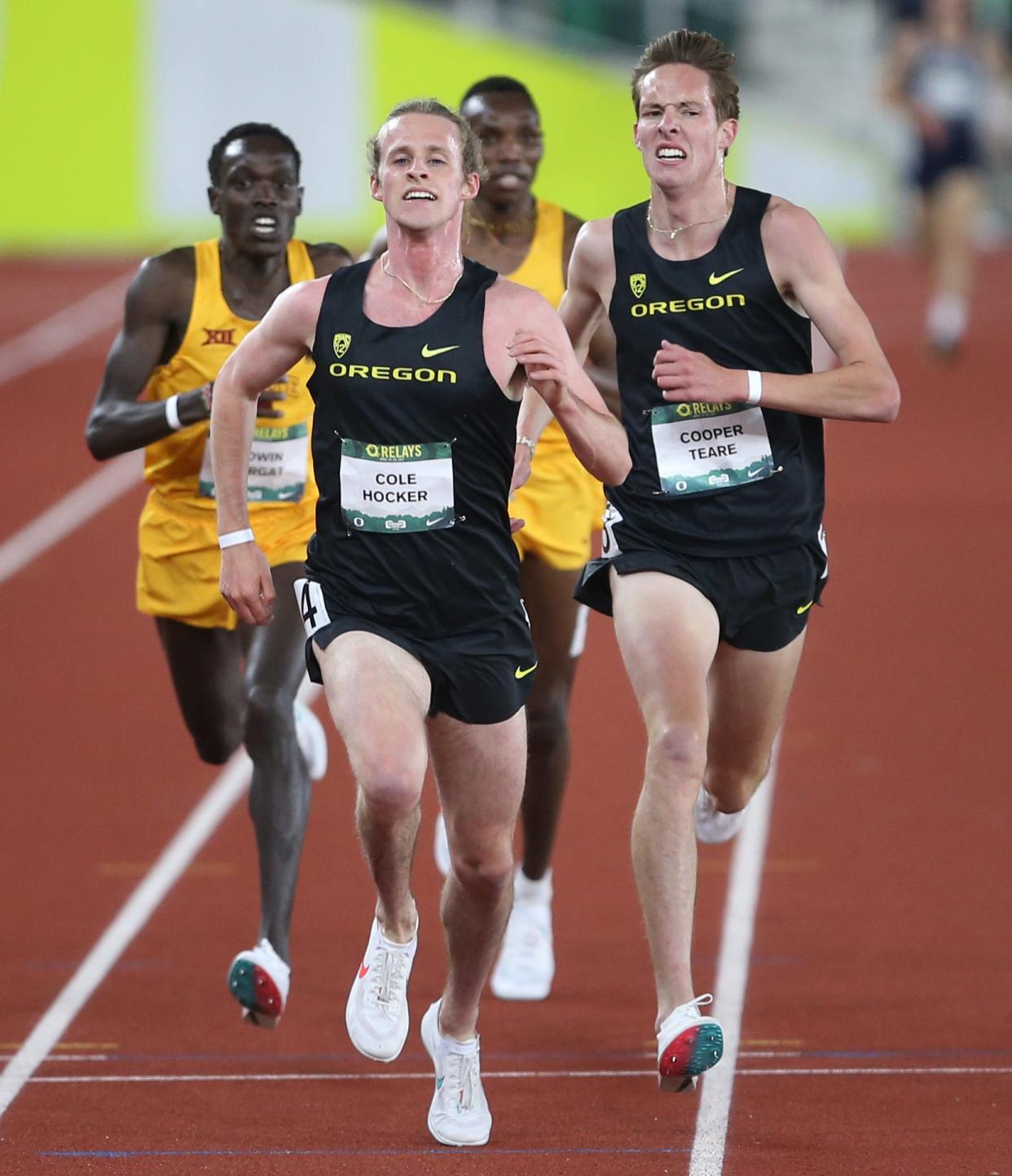Former Ducks Cole Hocker, middle, and Cooper Teare, right, will reunite for a attempt to take down the 4xMile world best on Saturday.