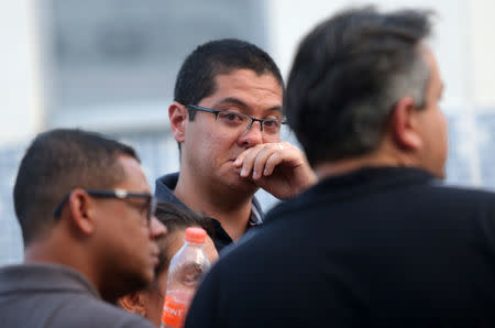 Vinicius Umezo, son of Marilena Umezo, employee of the Raul Brasil school and vcitim of a shooting, reacts at the Institute of Forensic Science, after the shooting in Suzano, Sao Paulo state, Brazil March 13, 2019. REUTERS/Amanda Perobelli