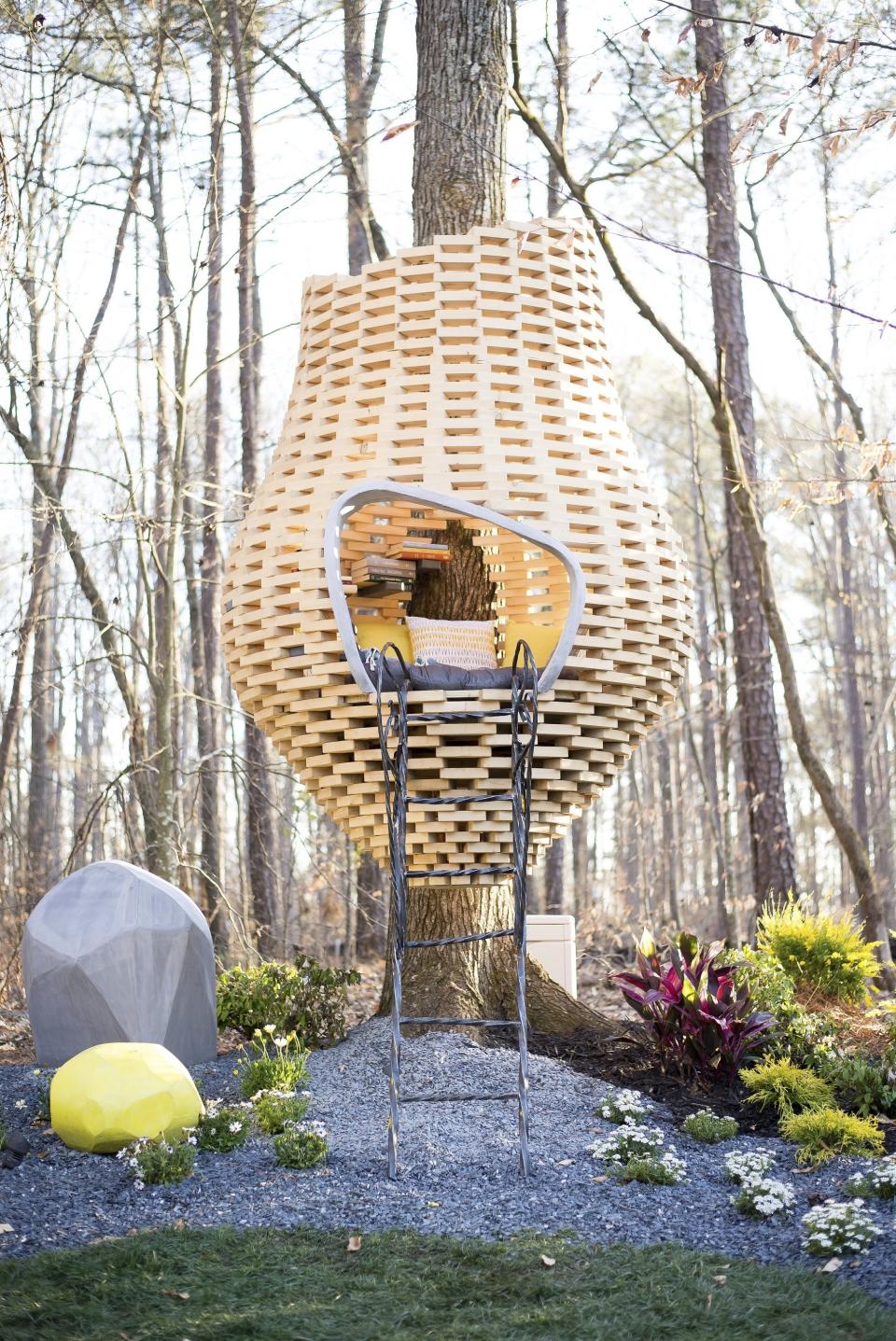 This undated photo provided by Chip Wade and Wade Works shows a honeycomb inspired reading pod Wade designed and built for one of his Forsyth County, Ga. book loving clients. (wadeworkscreative.com/Chip Wade via AP)