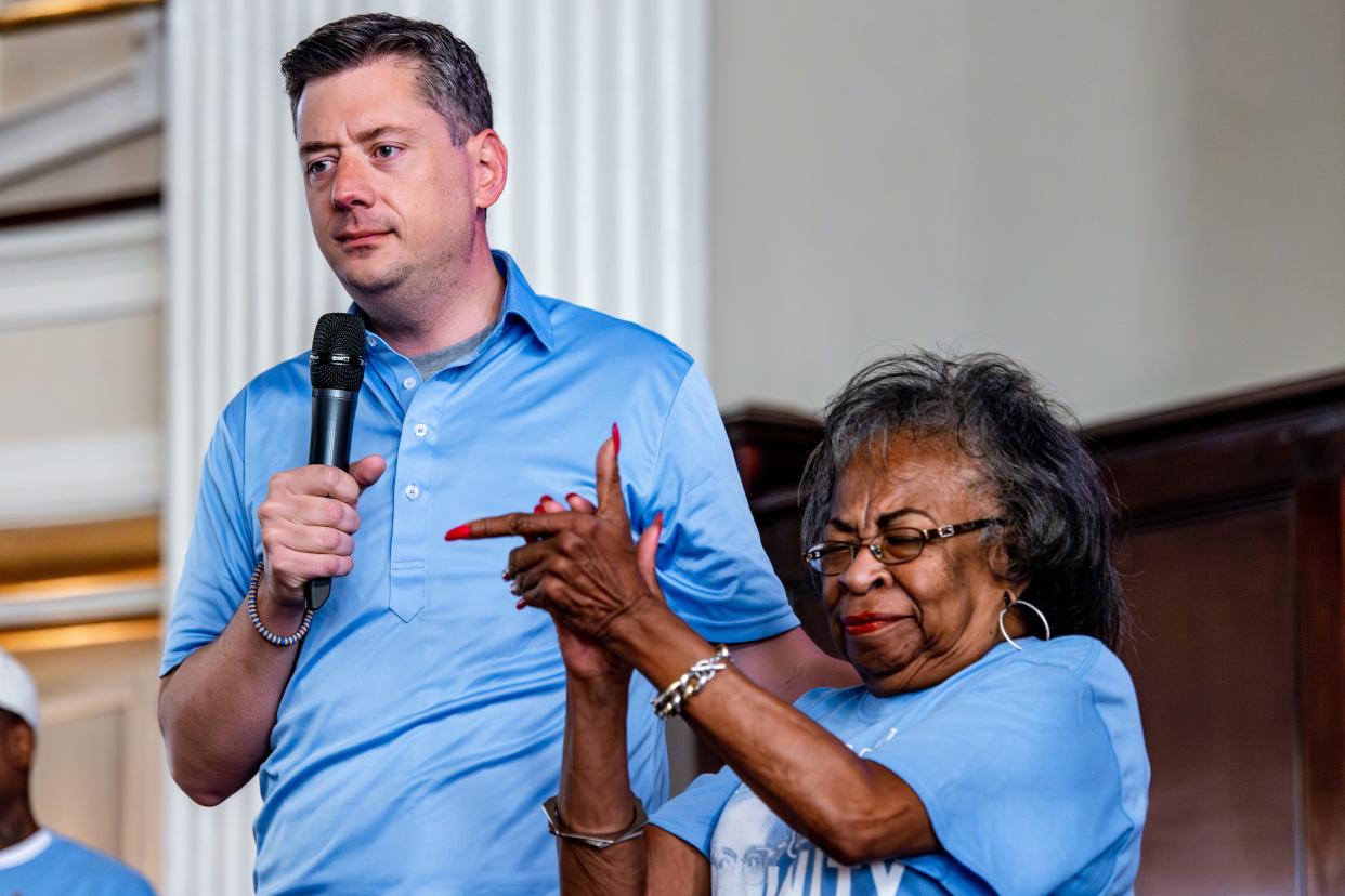 Oklahoma City Mayor David Holt speaks with Marilyn Luper Hildreth to a group Aug. 19 before a reenactment, including a marching from Frontline Church and a sit-in at Kaiser's Grateful Bean, in Oklahoma City for the 65th anniversary of the Oklahoma City sit-in movement.