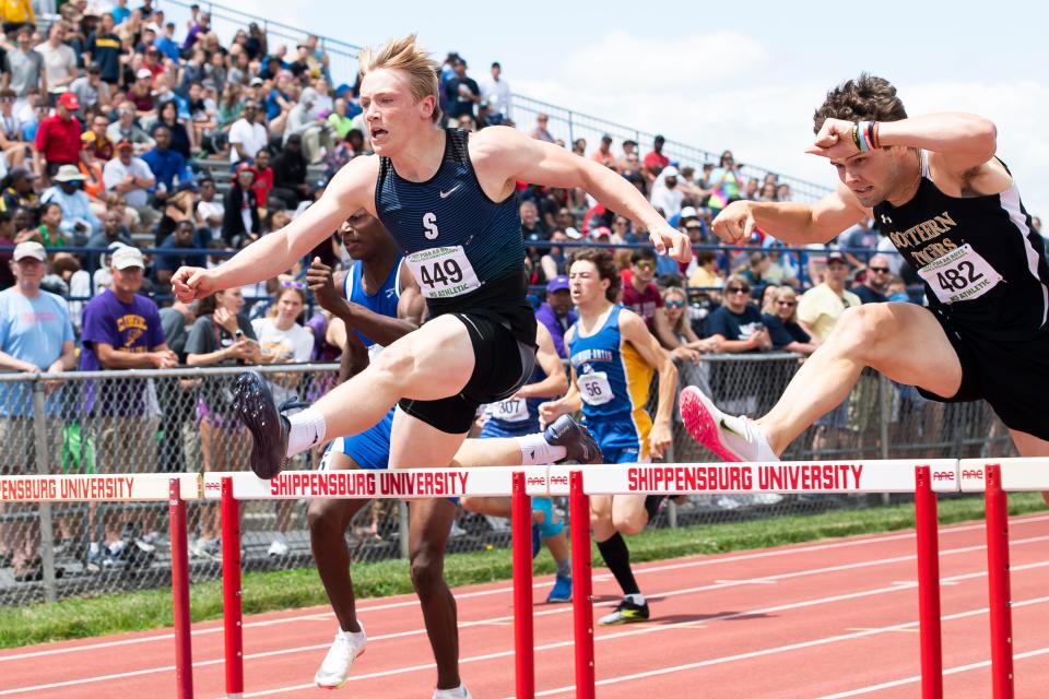 Seneca's Ryan Miller (449) clear a hurdle on the way to the silver medal in the Class 2A 300-meter hurdles at the PIAA track and field championships at Shippensburg University on Saturday.