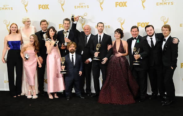 The cast and writers of Game of Thrones pose in the press room at the 2015 Emmy Awards