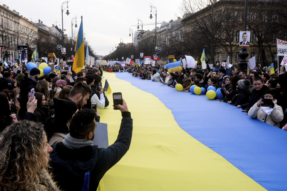 FILE - Thousands of protesters gathered in Budapest, Hungary, to demonstrate against Russia's invasion of Ukraine, Feb. 26, 2022. Hungary’s right-wing nationalist prime minister, Viktor Orban, has nurtured close political and economic ties with Russia for more than a decade. But following Russia's large-scale invasion of Ukraine, Hungary's neighbor, Orban is facing growing pressure to change course. (AP Photo/Justin Spike, File)