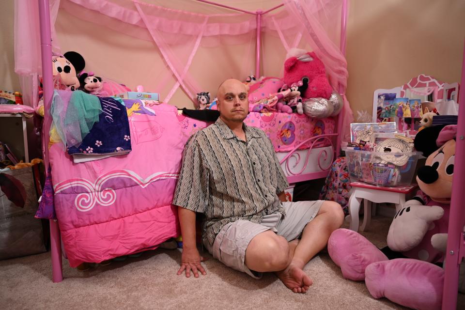 John Rex has been looking for his two missing daughters (Hanna Lee, 7, and Skye Rex, 5) since 2020. The daughters' mother disappeared with the two girls after Rex was granted full custody.. 
Rex poses here inside his daughter’s bedroom. He has not changed anything since they were kidnapped. He wants to maintain the room so when the kids return, they will have a familiar place.