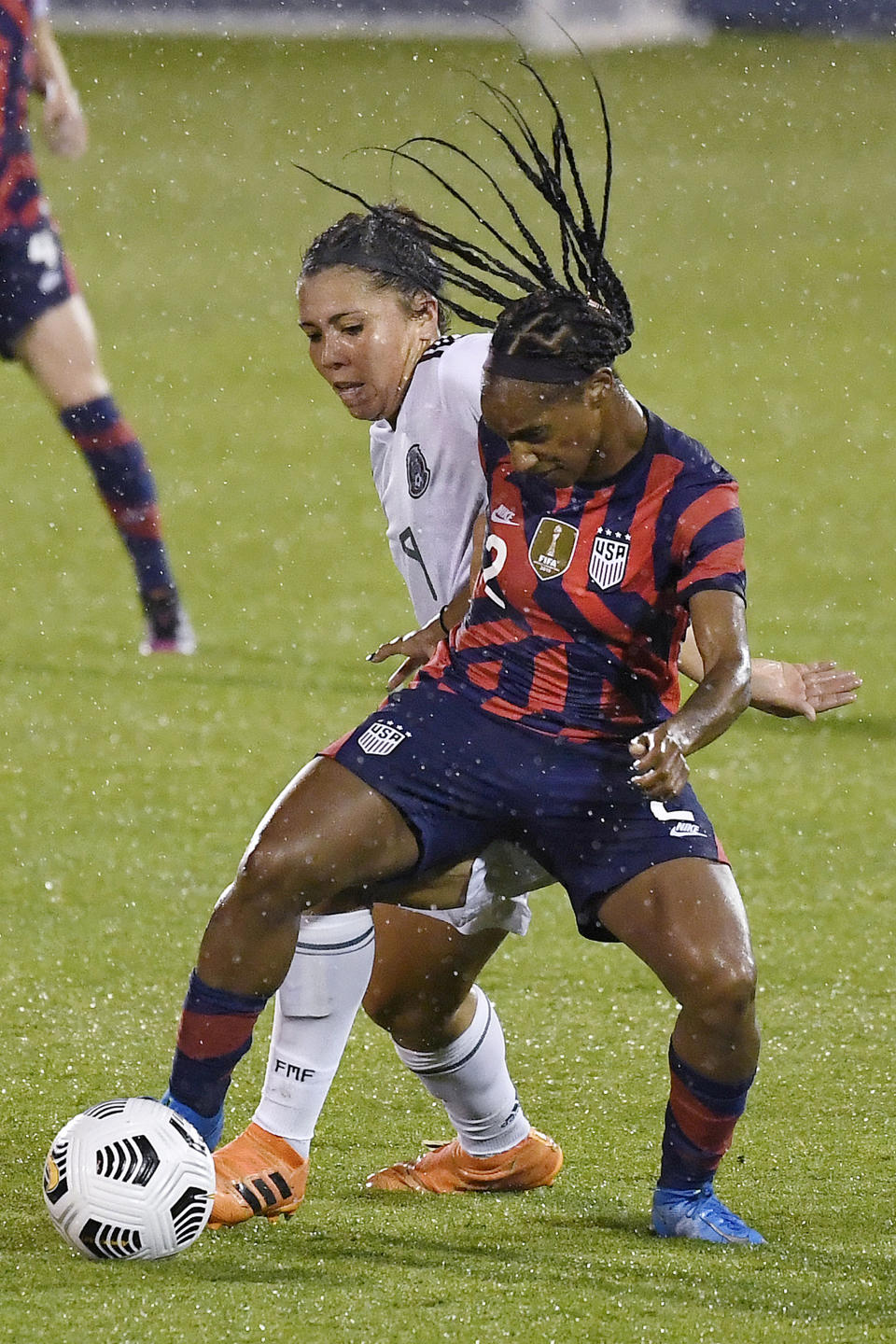 United States' Crystal Dunn, right, keeps the ball from Mexico's Kiana Palacios during the second half of an international friendly soccer match Thursday, July 1, 2021, in East Hartford, Conn. (AP Photo/Jessica Hill)