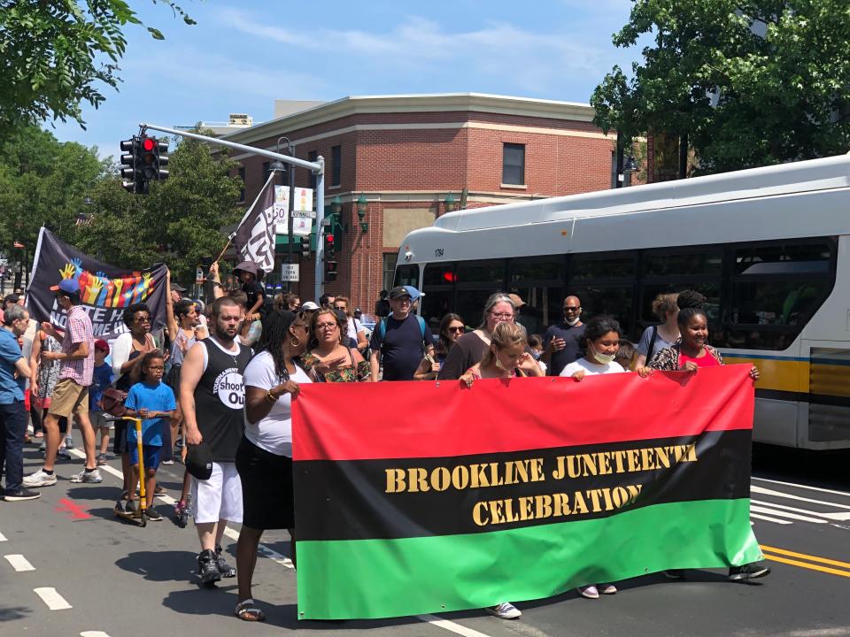 More than 150 people marched down Harvard Street for Brookline, Massachusetts' first annual Juneteenth celebration.