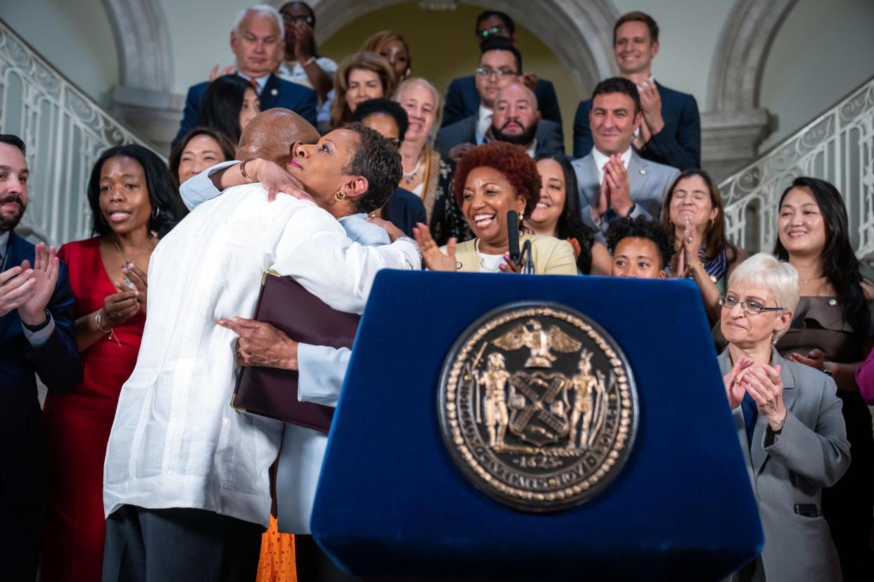New York City Mayor Eric Adams (left) hugs New York City Council Speaker Adrienne Adams after announcing an agreement for a city budget for Fiscal Year 2023 (FY23) at City Hall in lower Manhattan, New York on Friday, June 10, 2022.