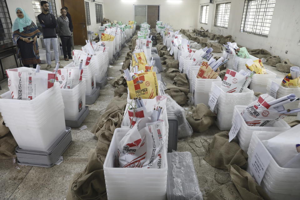 Ballot boxes and election material are laid out for distribution in Dhaka, Bangladesh,Saturday, Jan. 6, 2024. An apparent arson fire on a train in Bangladesh’s capital killed four people late Friday and added to the country’s extreme tension ahead of Sunday’s parliamentary elections that the opposition is seeking to boycott and disrupt with a general strike. (AP Photo/Mahmud Hossain Opu)