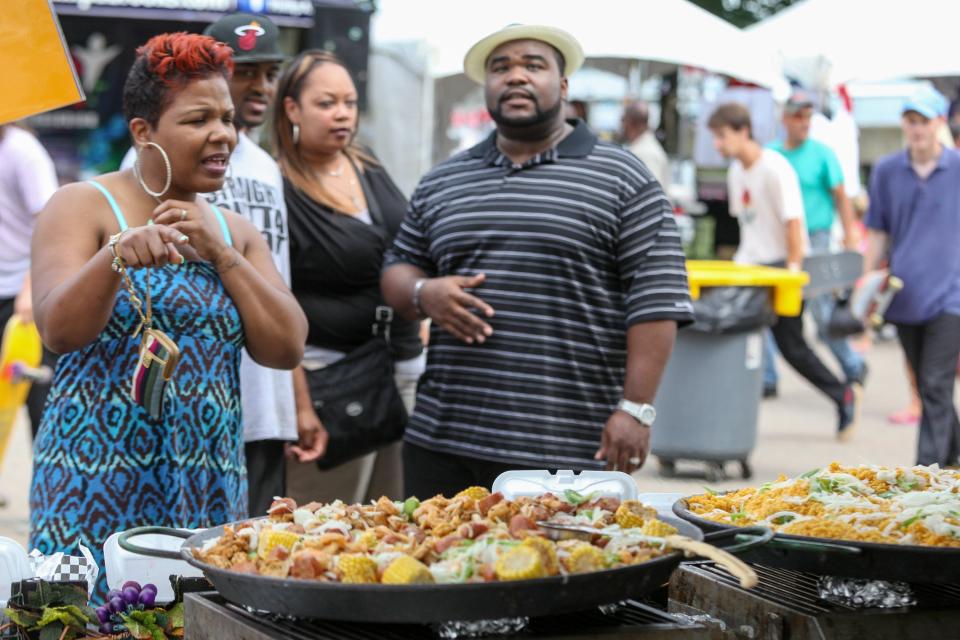 Ribs and all the fixings compete with music for visitors' attention at the Ribs R&B Music Festival.