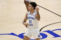 Memphis guard Lester Quinones (11) celebrates sinking a 3-point basket in the first half of an NCAA college basketball championship game against Memphis in the NIT, Sunday, March 28, 2021, in Frisco, Texas. (AP Photo/Tony Gutierrez)