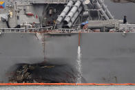 <p>The damaged port aft hull of the USS John S. McCain, is visible while docked at Singapore’s Changi naval base on Aug. 22, 2017 in Singapore. (Photo: Wong Maye-E/AP) </p>