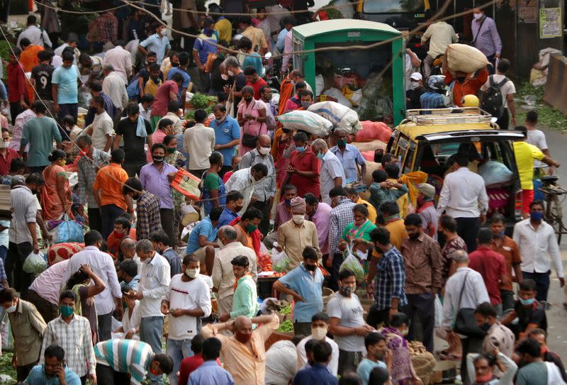 People shop at a crowded marketplace amidst the spread of the coronavirus disease (COVID-19) in Mumbai