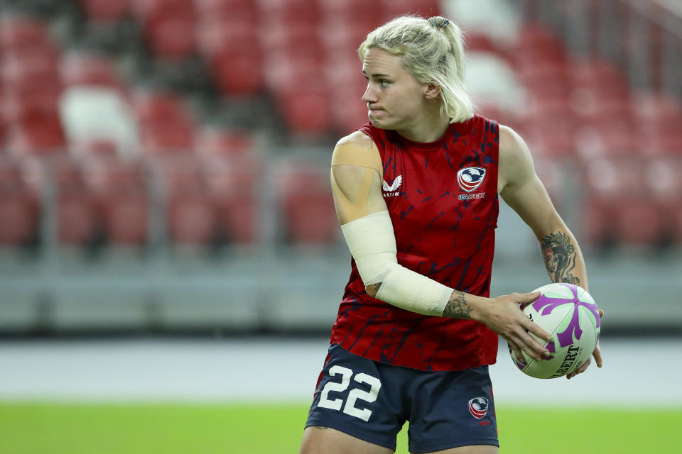 Sammy Sullivan of USA in action during HSBC rugby sevens series in Singapore, on May 4, 2024. The anthem played as Army officer Sammy Sullivan stood to attention and saluted beside her U.S. rugby teammates before a gold-medal game in Hong Kong against Olympic champion New Zealand. No prizes for guessing where her mind may have drifted to: Paris in July. (AP Photo/Suhaimi Abdullah)
