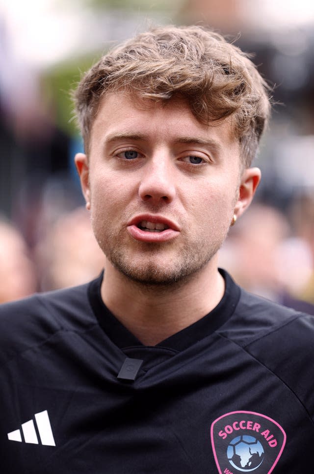 Roman Kemp in a Soccer Aid football top