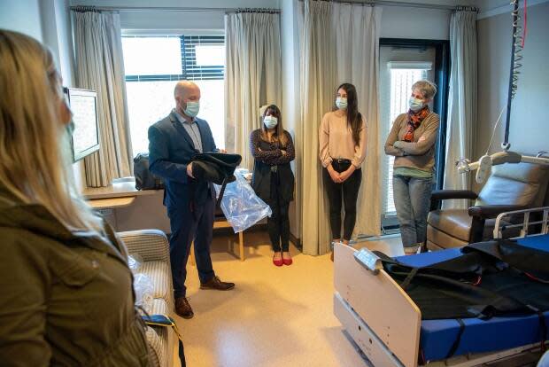 Officials mark the reopening of the Irene Thomas Hospice under the operation of the Fraser Health authority on April 15. (Submitted by Fraser Health/Steve Ray  - image credit)