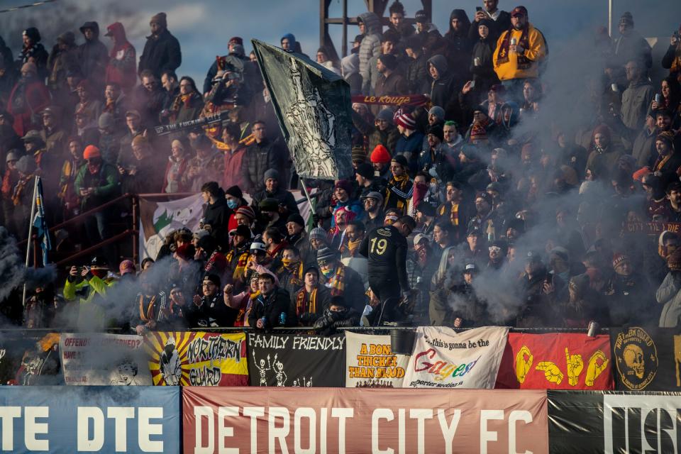 DCFC fans fill the stand with people and colorful smoke during the game between Detroit City FC and Columbus Crew at Keyworth Stadium in Hamtramck on Tuesday, April 19, 2022.