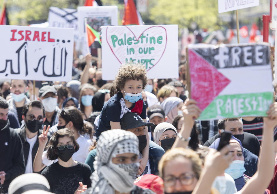 People in Montreal attend a demonstration on Saturday, May 15, 2021, to denounce Israel's military actions in the Palestinian territories. (Graham Hughes/The Canadian Press via AP)