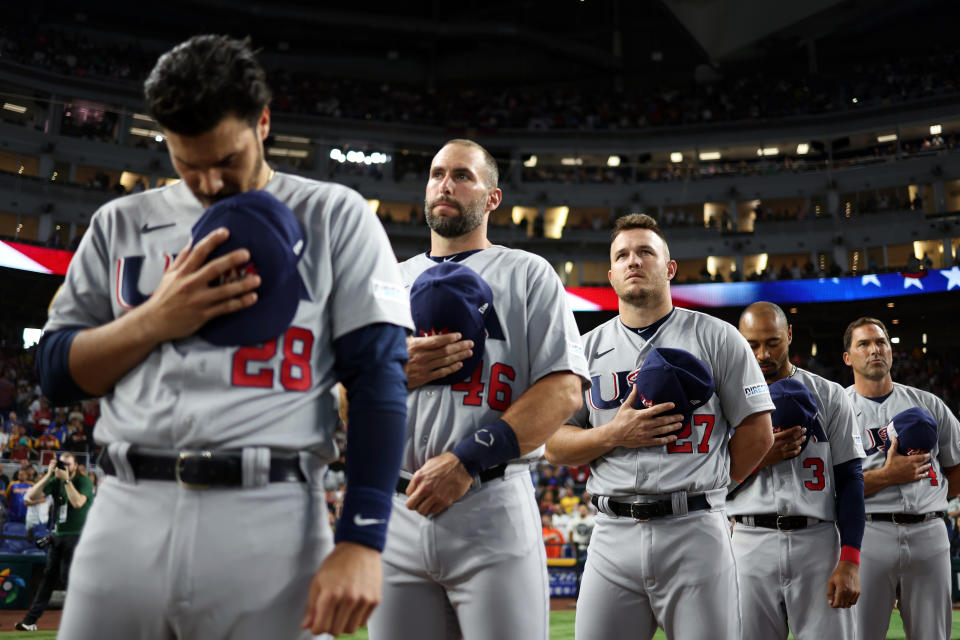 MIAMI, FL - MARCH 18:  Paul Goldschmidt #46 and Mike Trout #27 of Team USA look on during the national anthems before the 2023 World Baseball Classic Quarterfinal game between Team USA and Team Venezuela at loanDepot Park on Saturday, March 18, 2023 in Miami, Florida. (Photo by Rob Tringali/WBCI/MLB Photos via Getty Images)