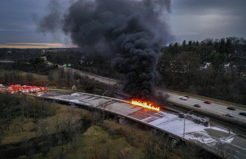 Fuel from an overturned tanker truck burns on northbound Interstate 795 in Pikesville, Md., on Friday morning, March 24, 2023. The driver of the truck was transported to a hospital for treatment, according to state police. (Jerry Jackson/The Baltimore Sun via AP)