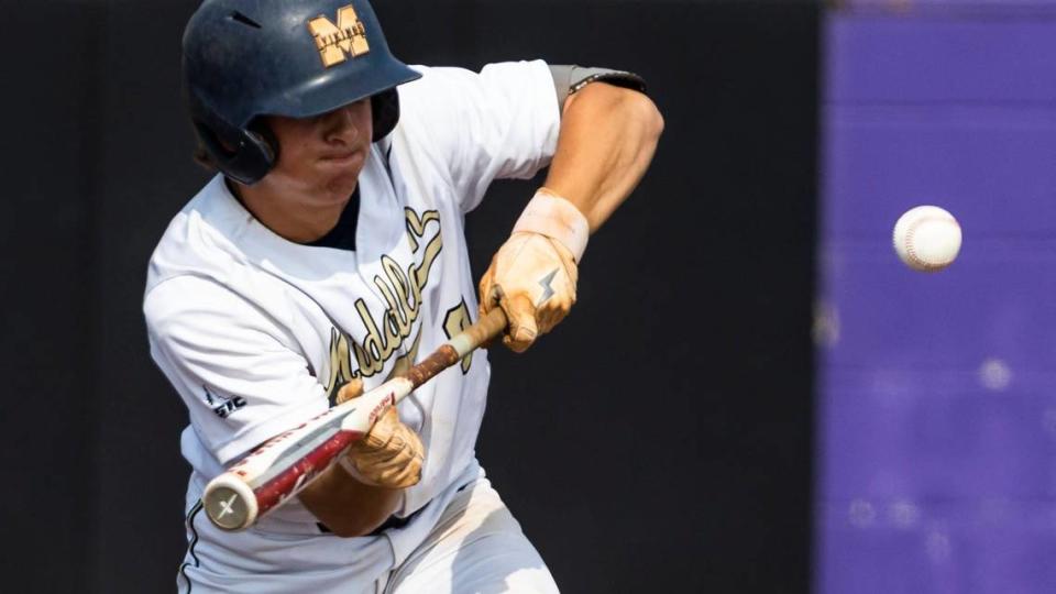 Middleton senior Caden Recla lays down a bunt during the first round of the 5A baseball state tournament.