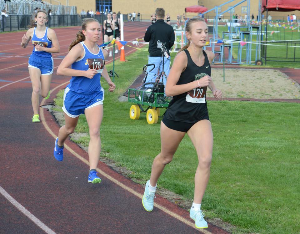 Jefferson’s Jenna Pilachowski trails Bella LaFountain of St. Mary Catholic Central in the 1,600 meters Tuesday. Pilachowski came back to win the race.