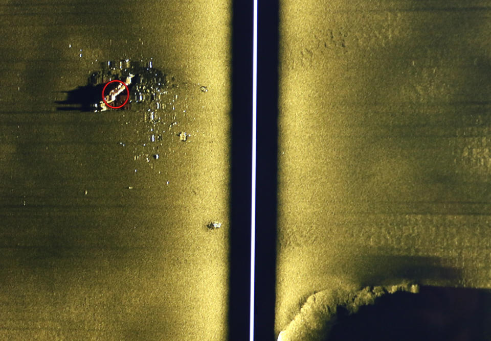 Rob Kraft, director of undersea operations at Vulcan Inc., reviews sonar scans of a warship from the World War II Battle of Midway that was found by the crew of the research vessel Petrel, Sunday, Oct. 20, 2019, off Midway Atoll in the Northwestern Hawaiian Islands. (AP Photo/Caleb Jones)