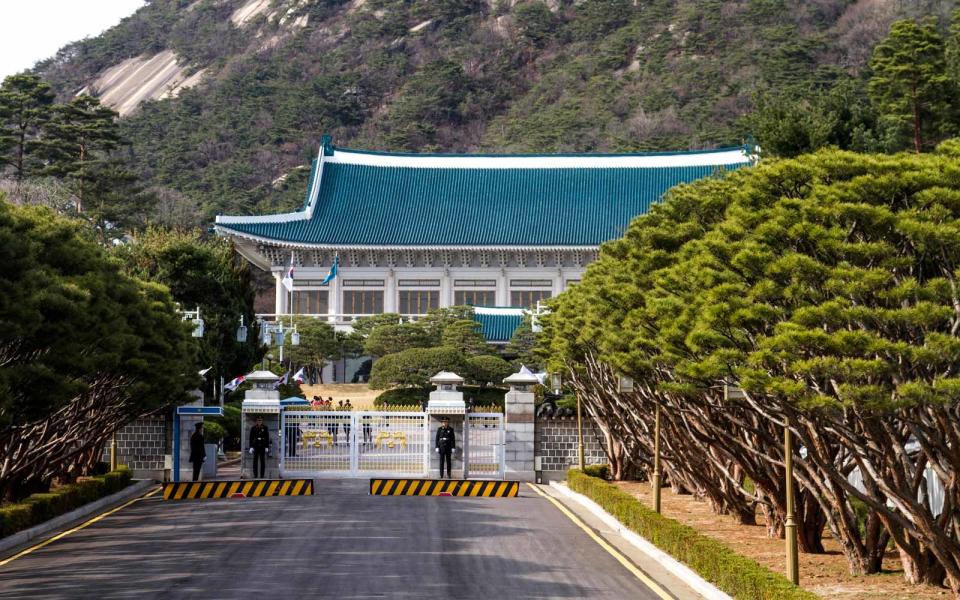 <p>Cheong Wa Dae, which translates as "Pavilion of blue tiles," is home to the President of the Republic of Korea Park Geun-Hye. It was built in traditional Korean architectural style on the site of a royal villa in <a rel="nofollow noopener" href="http://www.travelandleisure.com/travel-guide/seoul" target="_blank" data-ylk="slk:Seoul;elm:context_link;itc:0;sec:content-canvas" class="link ">Seoul</a> dating back to the 10th century Koryo dynasty. It is a particularly young presidential abode, having only been completed in 1991. The blue tiles of the pavilion are the buildings most distinguishable feature and combined with the Bugaksan Mountain behind give this presidential home a unique, picturesque beauty. The presidential gardens that surround the blue house are home to the national Mugunghwa flower, a 300-year-old pine tree and a succession of trees planted by each president to take power.</p>