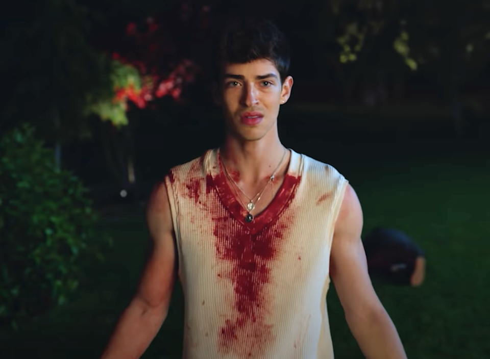 A guy with blood all over his shirt