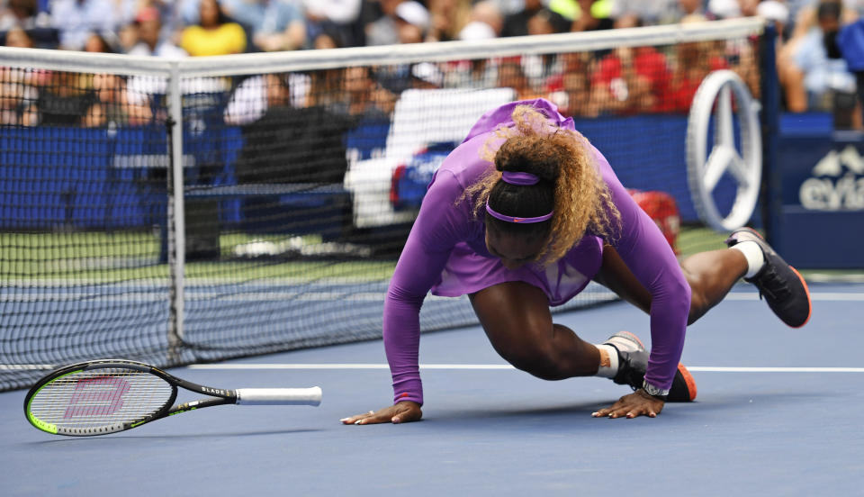 Serena Williams, of the United States, falls while chasing a return to Petra Martic, of Croatia, during round four of the US Open tennis championships Sunday, Sept. 1, 2019, in New York. (AP Photo/Sarah Stier)