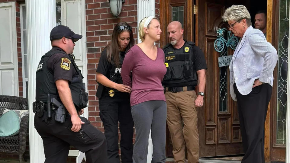 Alissa McCommon is arrested in front of her house