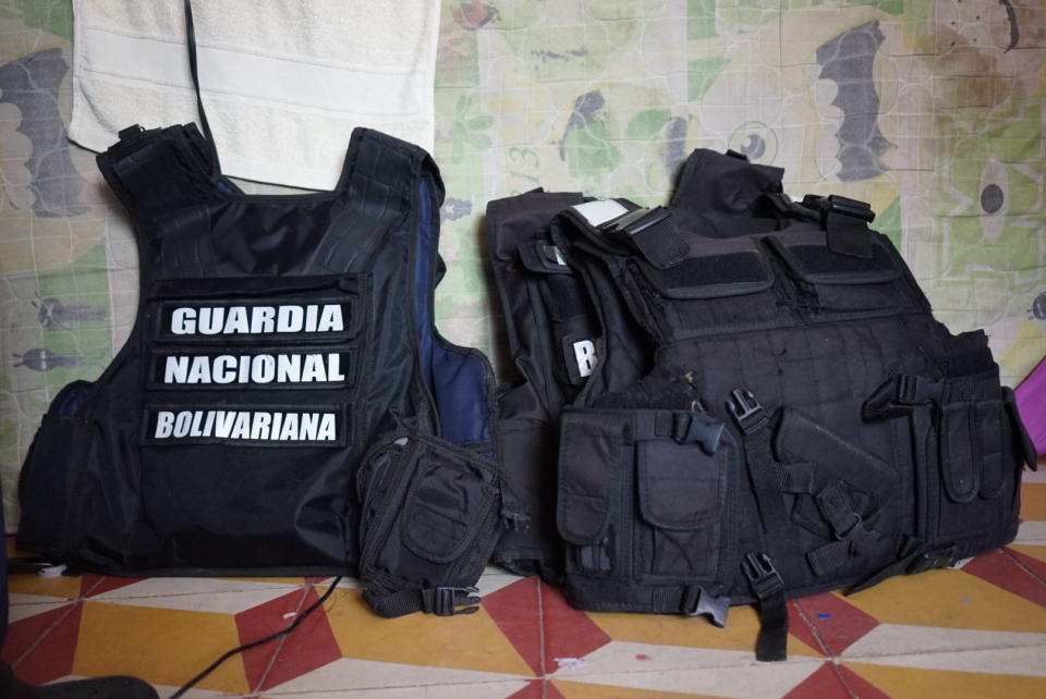 Chest vests belonging to defected members of Venezuela's Bolivarian National Guard sit in room where they are sleeping at a shelter run by a priest in Cucuta, Colombia, Monday, Feb. 25, 2019. The simple house on a street ridden with potholes in this town on Colombia’s restive border with Venezuela has become a refuge for the newly homeless: 40 Venezuelan soldiers who abandoned their posts and ran for their lives. (AP Photo/Christine Armario)