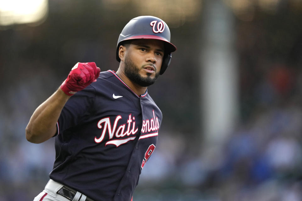 Washington Nationals' Jeimer Candelario celebrates his two-run home run off Chicago Cubs starting pitcher Drew Smyly as he rounds first during the first inning of a baseball game Monday, July 17, 2023, in Chicago. (AP Photo/Charles Rex Arbogast)