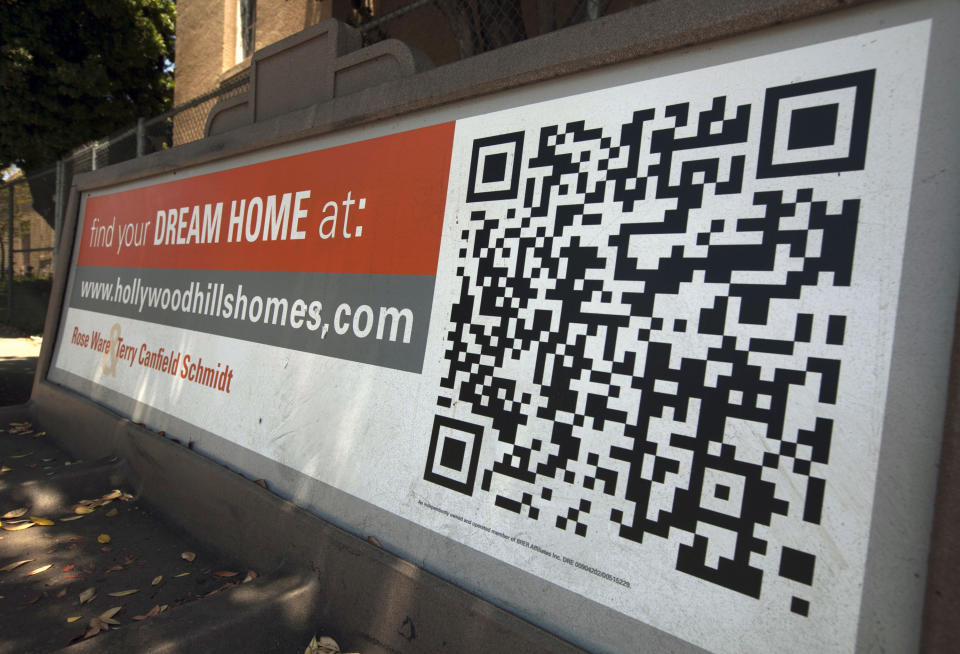 In this Tuesday, July 17, 2012 photo, a Quick Response Code is used on Realtor ad offering "dream homes" in the Hollywood Hills area of Los Angeles. Americans bought more homes in July than in June and prices rose, the latest evidence that the housing market is slowly recovering. Sales of previously occupied homes rose to 4.47 million in July, a 2.3 percent increase from the previous month, the National Association of Realtors said Wednesday. (AP Photo/Damian Dovarganes)
