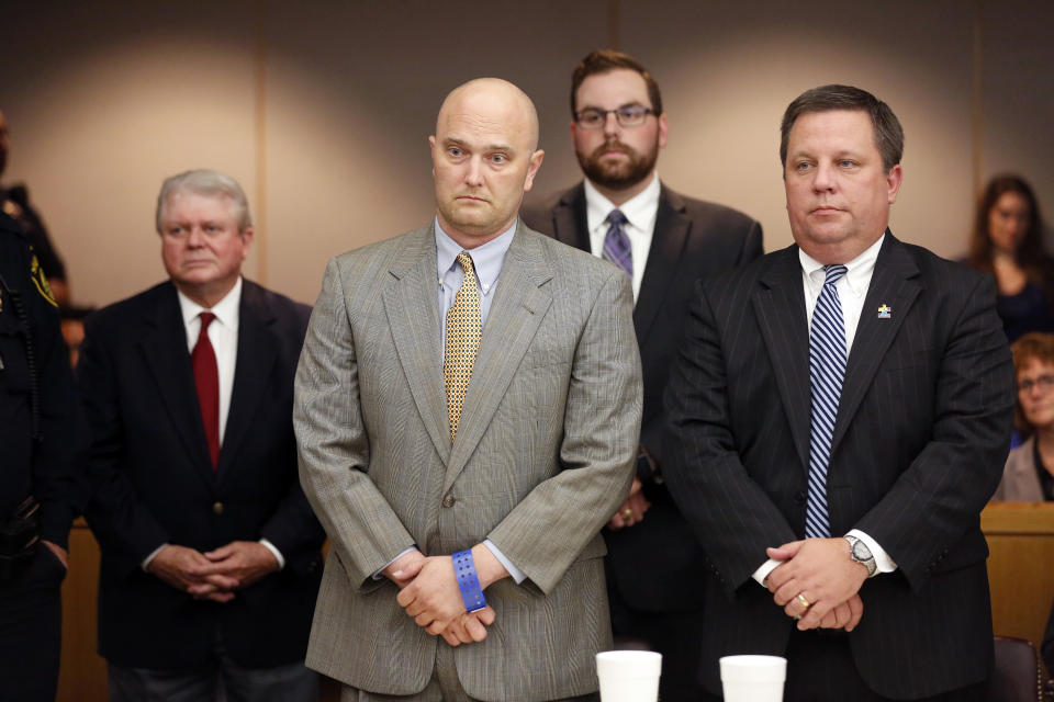 Former Balch Springs Police Officer Roy Oliver, foreground left, stands next to defense attorney Miles Brissette, right, after being sentenced to 15 years in prison for the murder of 15-year-old Jordan Edwards, Wednesday, Aug. 29, 2018, at the Frank Crowley Courts Building, in Dallas. (Rose Baca/The Dallas Morning News via AP, Pool)