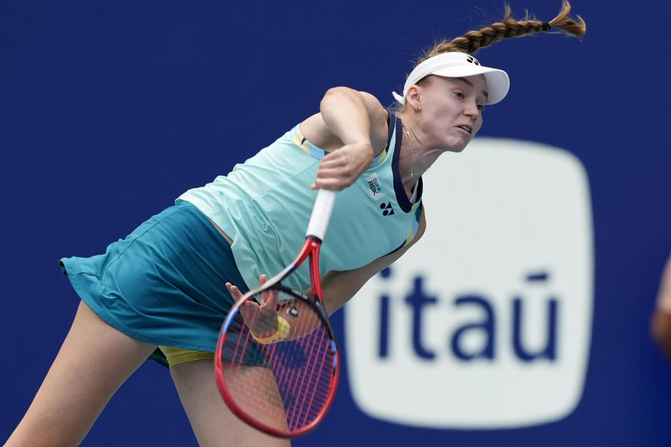 Elena Rybakina, of Kazakhstan, follows through on a serve to Danielle Collins during the women's singles final of the Miami Open tennis tournament, Saturday, March 30, 2024, in Miami Gardens, Fla. (AP Photo/Lynne Sladky)