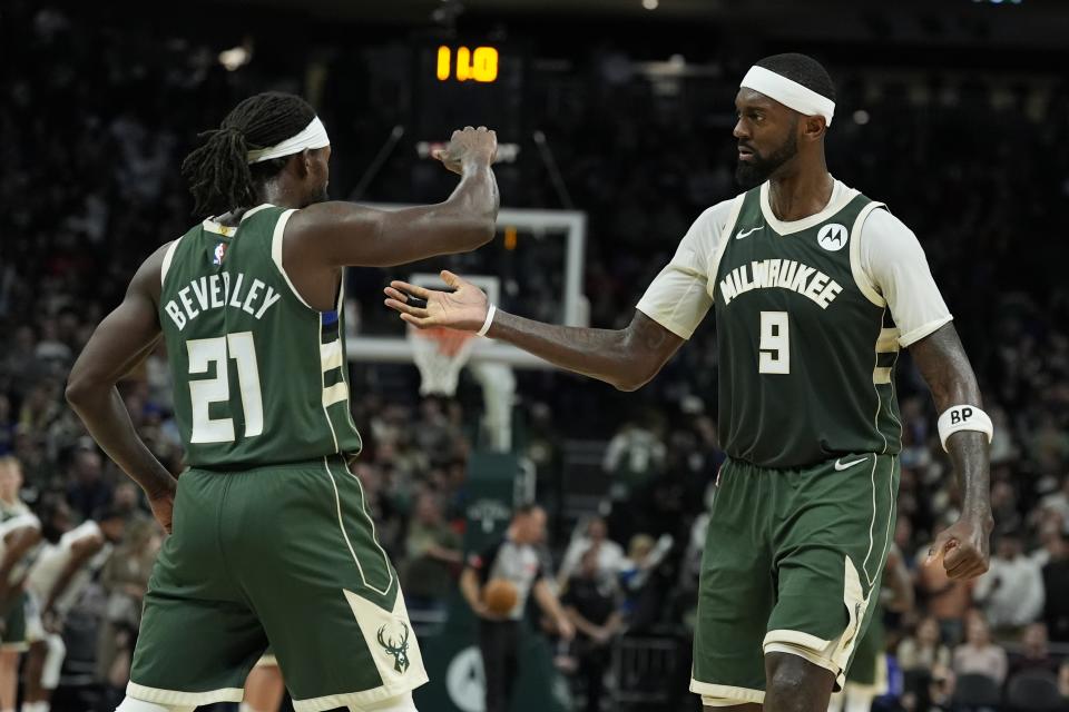 Milwaukee Bucks' Bobby Portis and Patrick Beverley celebrate during the second half of an NBA basketball game against the Los Angeles Clippers Monday, March 4, 2024, in Milwaukee. The Bucks won 113-106. (AP Photo/Morry Gash)