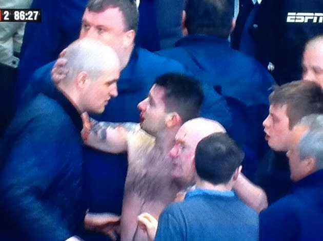 A topless and bloodied Millwall fan (@awaydays_)