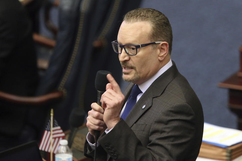 Rep. Ralph Massullo, R-Lecanto, debates on the bill to ban the banning of sunscreen containing ingredients that some researchers say harm coral reefs during session Tuesday March 10, 2020, in Tallahassee, Fla. (AP Photo/Steve Cannon)