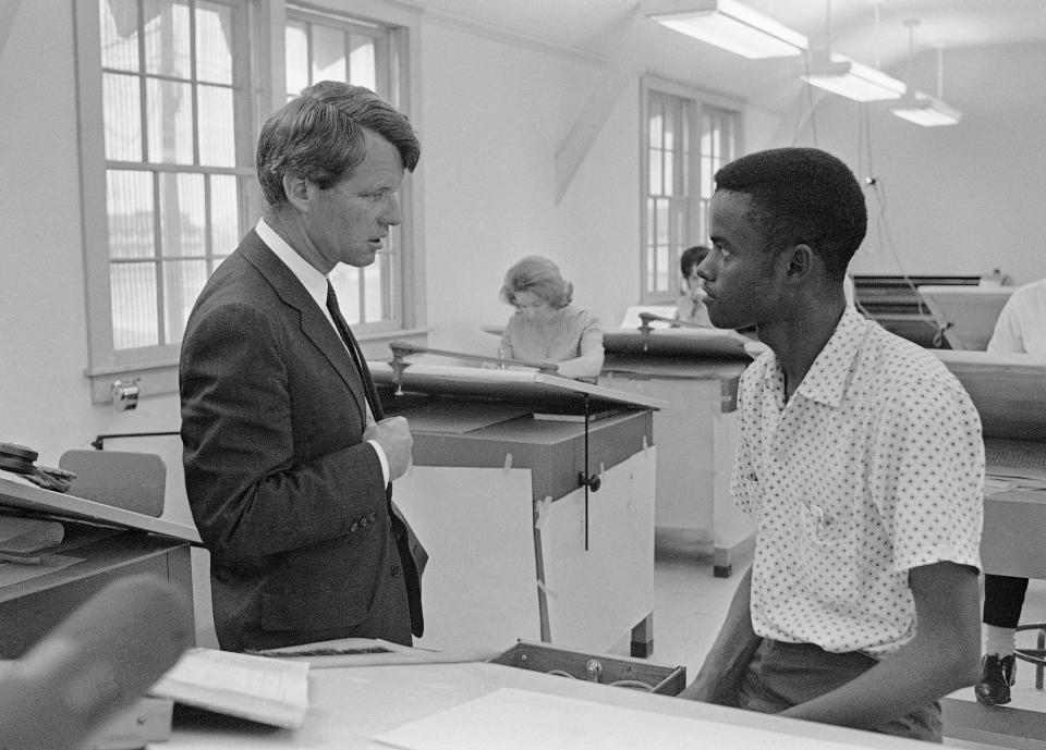 <p>Kennedy talks with a student at the Manpower Development and Training Center at Greenville, Miss., April 12, 1967. (Photo: Jack Thornell/AP) </p>